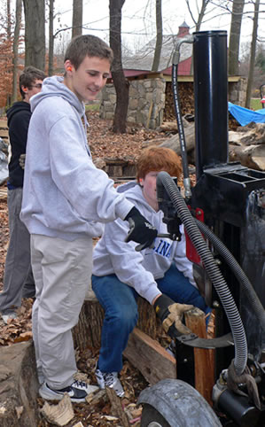 volunteers cutting wood